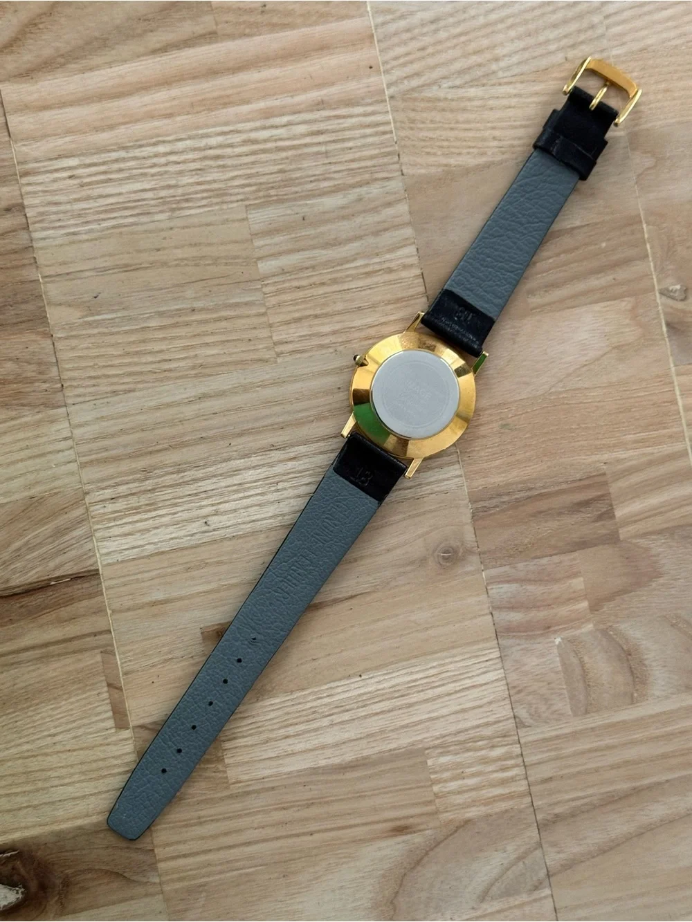 General Tire Dress Watch Black Dial Leather Strap Gold-Tone Case Hands